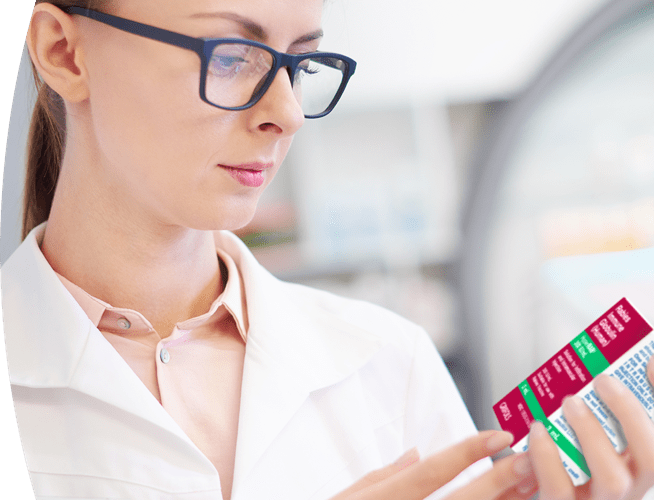 Female medical professional holding a box of human rabies immune globulin (HRIG).